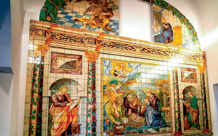 National Tile Museum mural depicting religious scenes in Lisbon, Portugal.