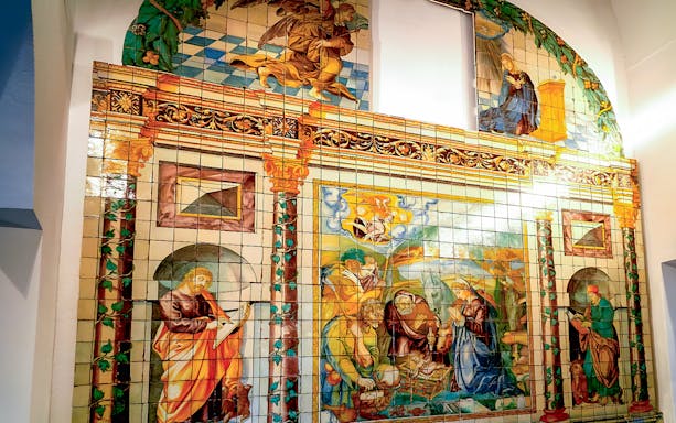 National Tile Museum mural depicting religious scenes in Lisbon, Portugal.