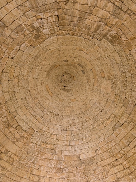 Stone ceiling of the Treasury of Atreus in Mycenae, Greece.