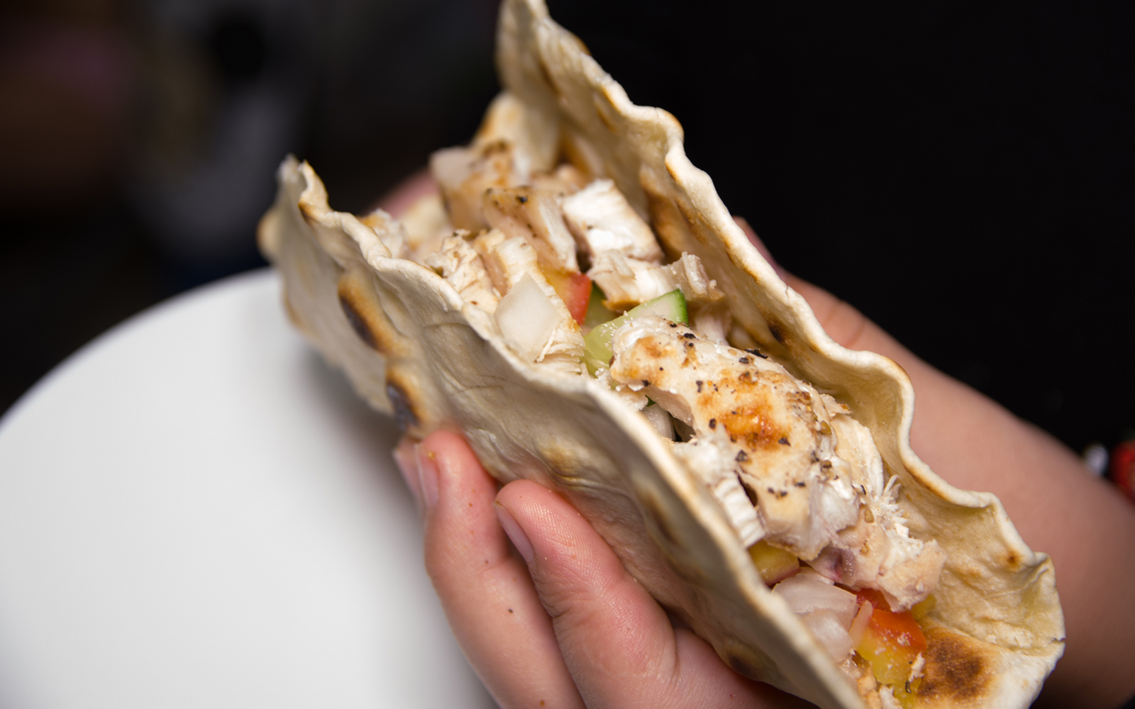 Traditional Mexican taco with cheese, served on a wooden board in Mexico City.