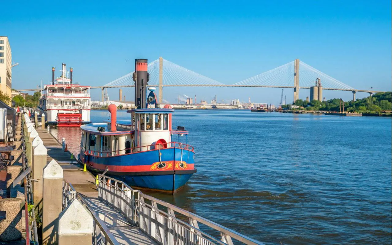 Riverboat docked along Savannah River with Talmadge Memorial Bridge in the background, Savannah.