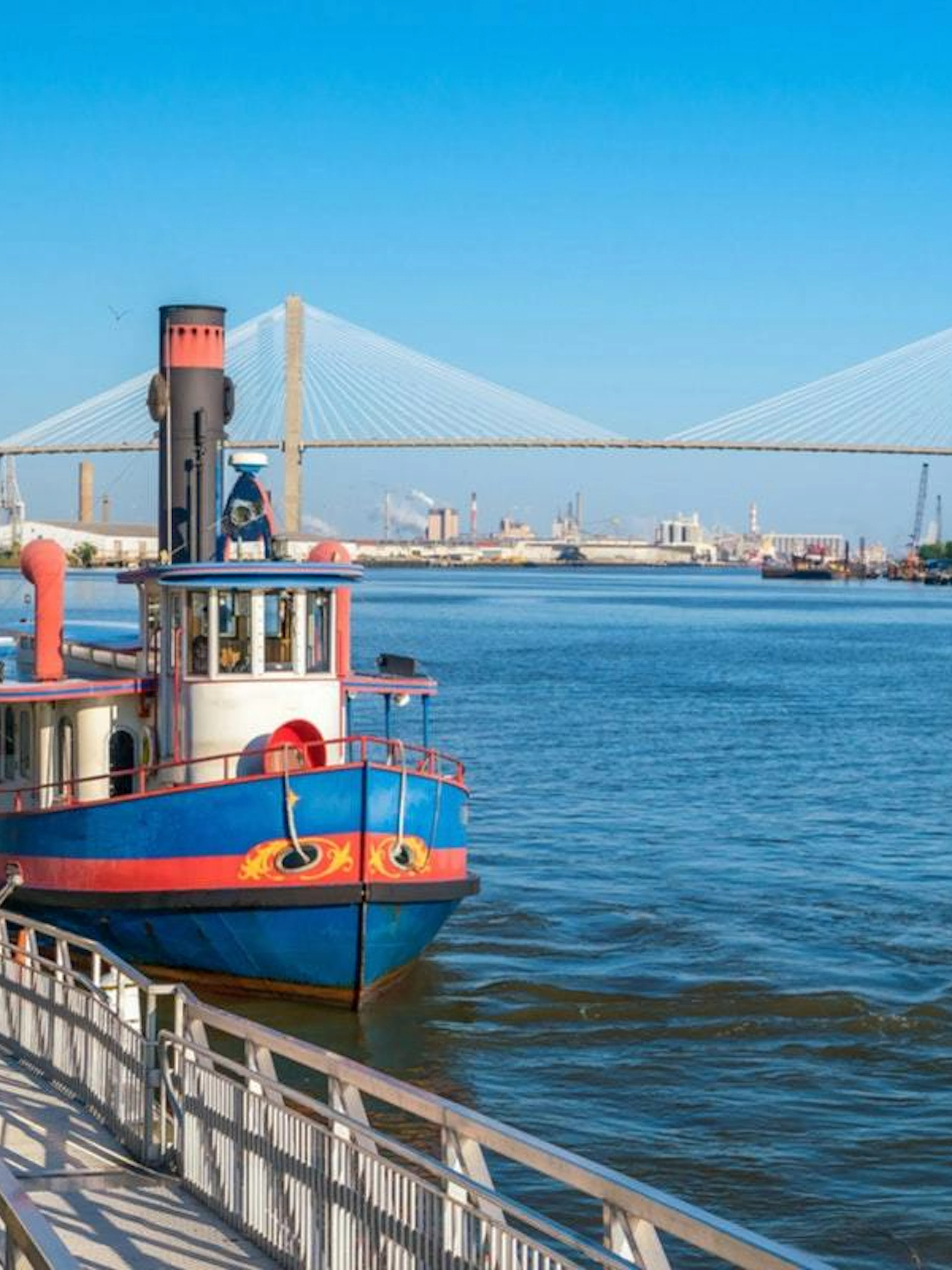 Riverboat docked along Savannah River with Talmadge Memorial Bridge in the background, Savannah.