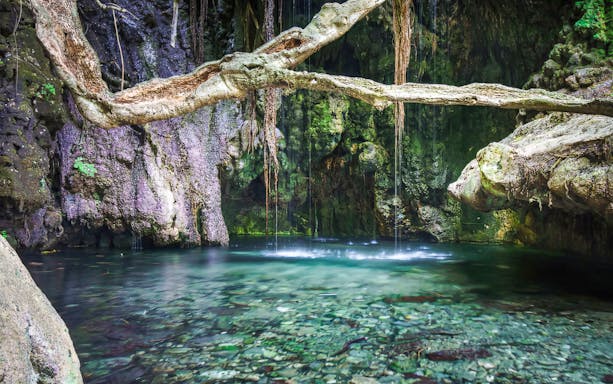 Aphrodite's Baths with clear water and surrounding rock formations in Paphos, Cyprus.