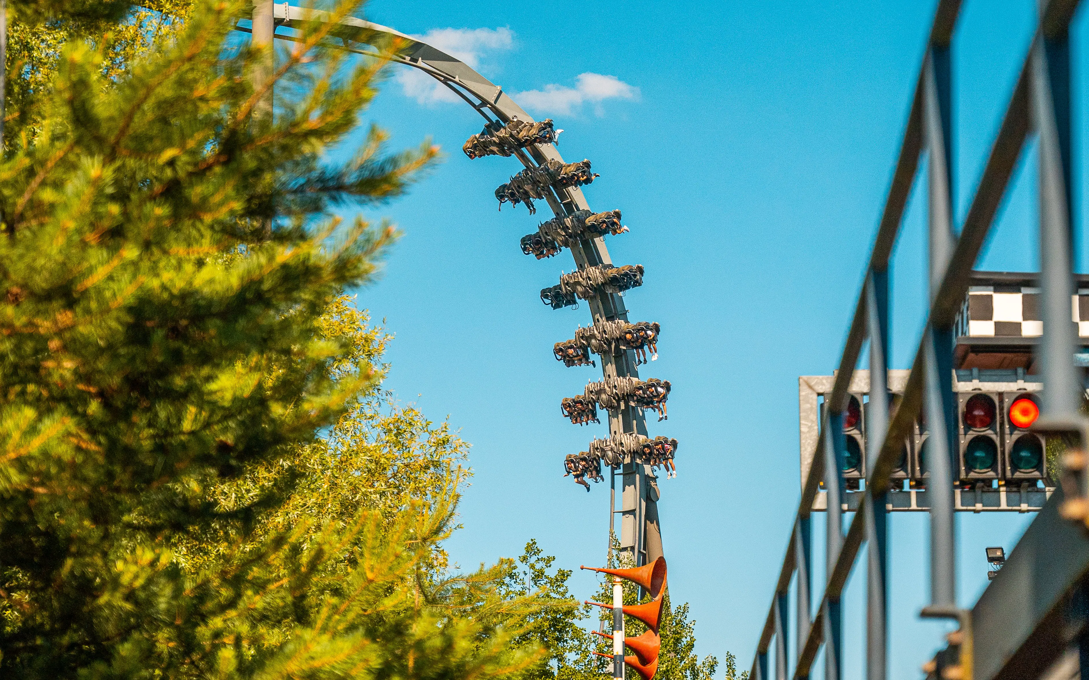 Roller coaster loop with riders at Thorpe Park.
