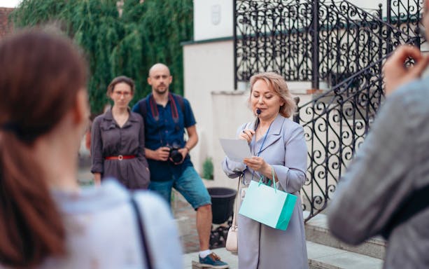 Tour guide speaking to a small group at Upper Belvedere Palace.