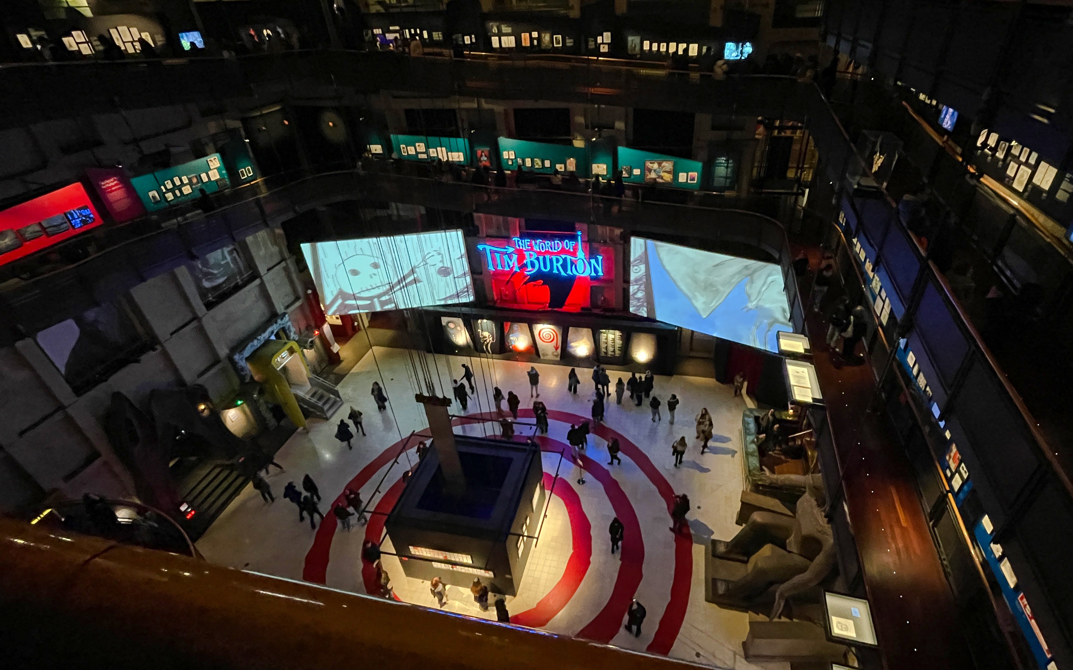 Interior view of the National Museum of Cinema in Turin featuring a Tim Burton exhibition.