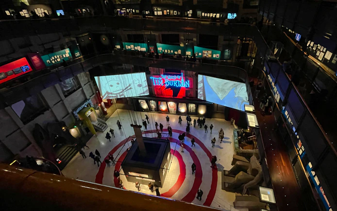 Interior view of the National Museum of Cinema in Turin featuring a Tim Burton exhibition.