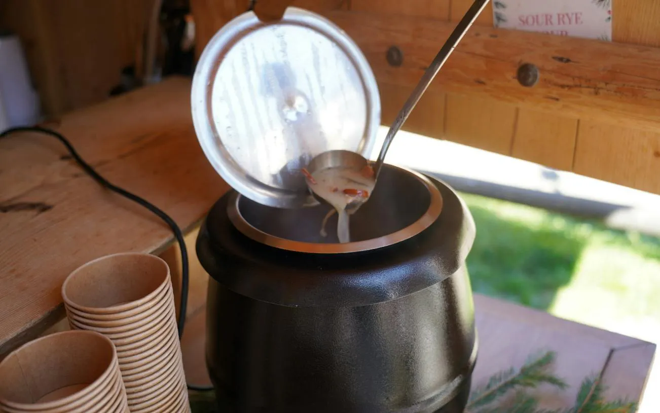 Ladle serving soup from a pot at Gorący Potok Thermal Baths, near Zakopane.