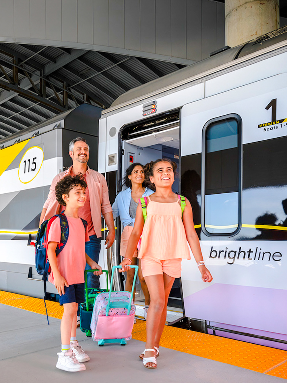 Family boarding Brightline train from Miami to Orlando.