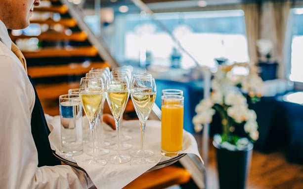 Drinks served on a tray during New Year's Eve dinner cruise.