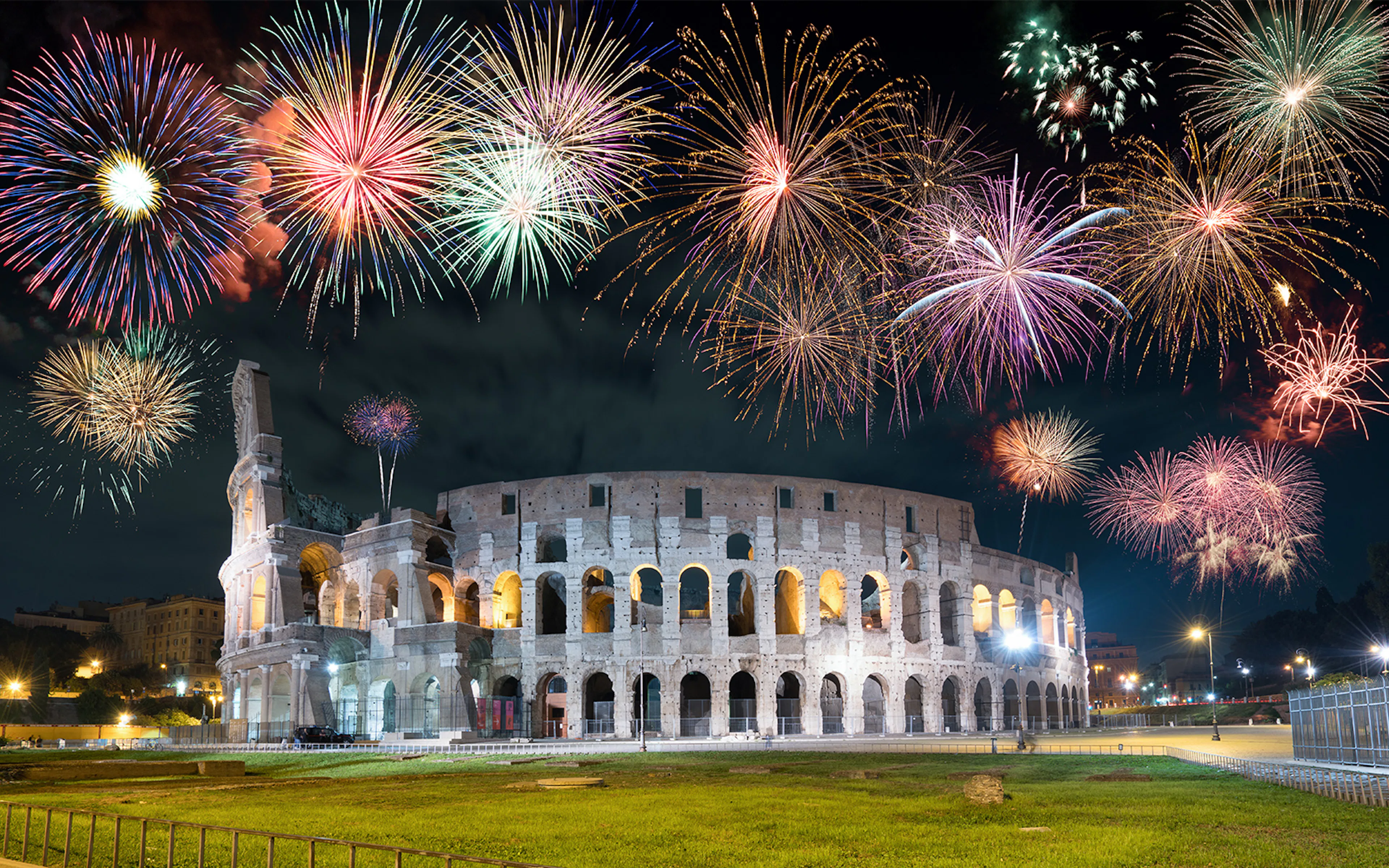 Fireworks over the Colosseum in Rome, Italy during New Year's celebration.
