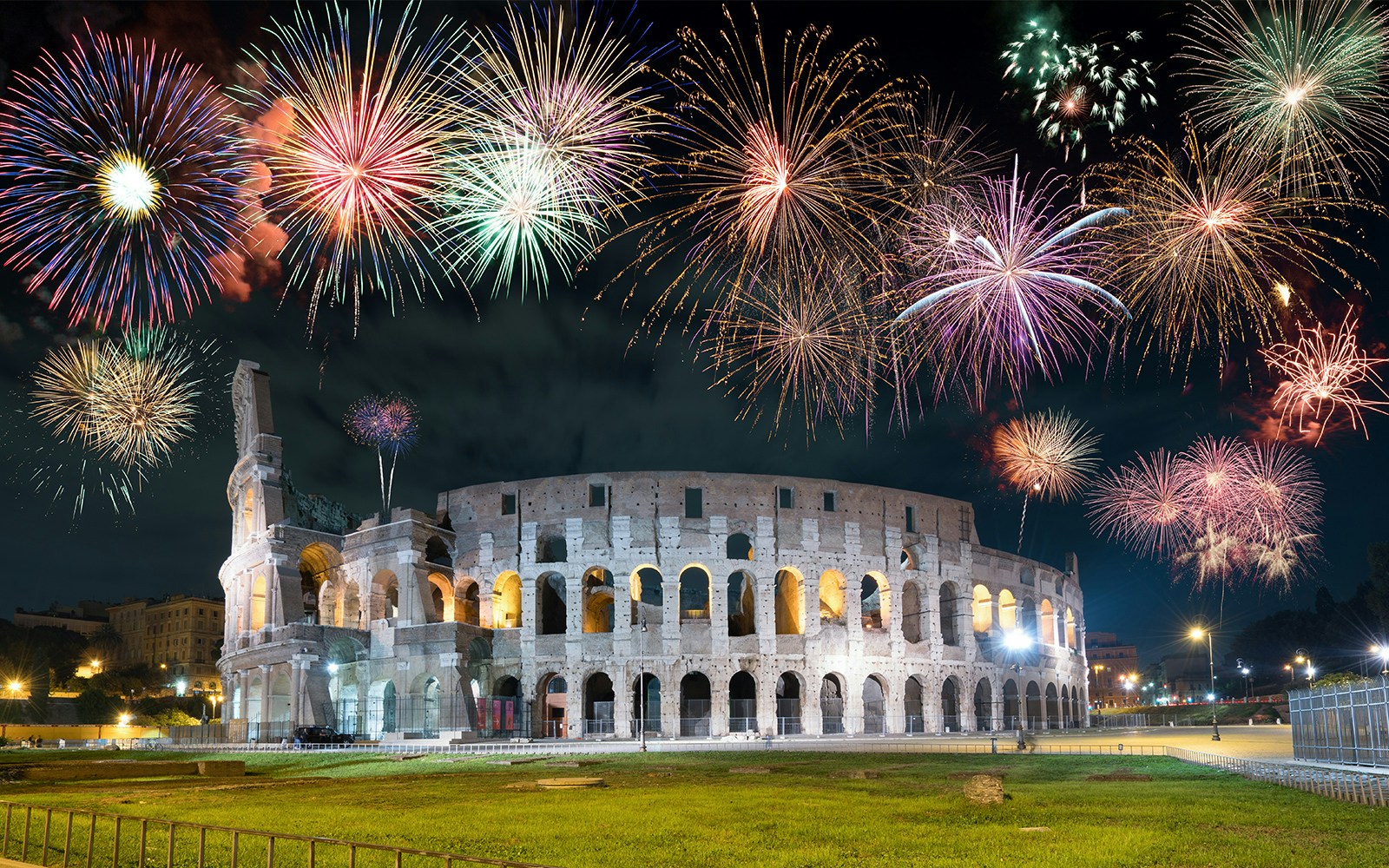 Fireworks over the Colosseum in Rome, Italy during New Year's celebration.
