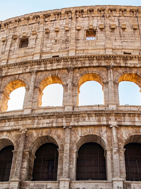 Colosseum exterior with arches, part of the Colosseum, Palatine Hill & Roman Forum tour.