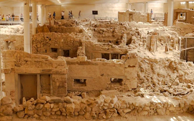Akrotiri archaeological ruins with ancient structures in Santorini.