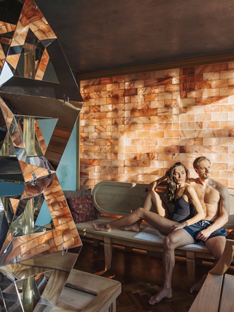 Visitors relaxing in a salt room at QC TermeTorino Spa, Italy.