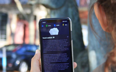 Self-guided city exploration game on phone screen in Lisbon.