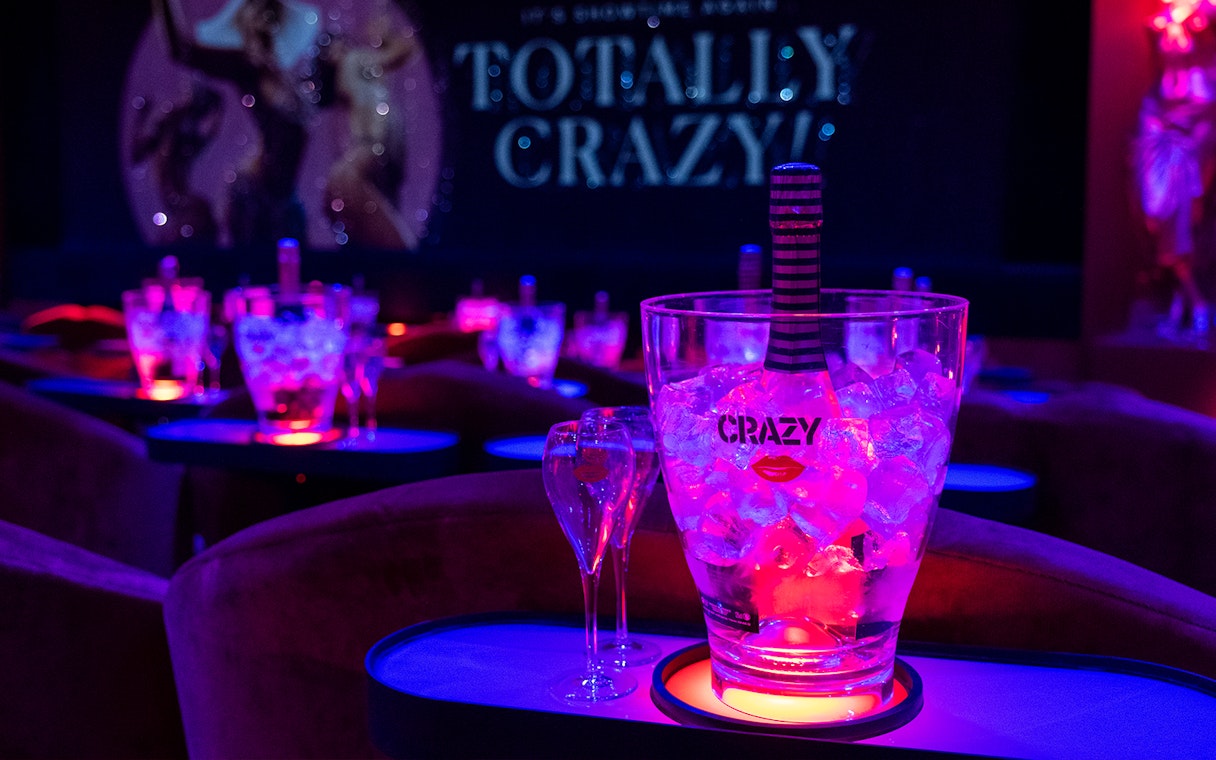 Ice bucket with champagne at Crazy Horse Cabaret Show, Paris.