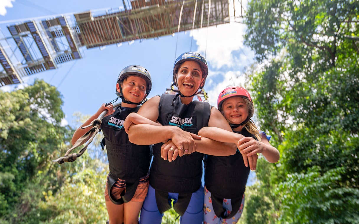 Family enjoying the Cairns Giant Swing experience in Australia.