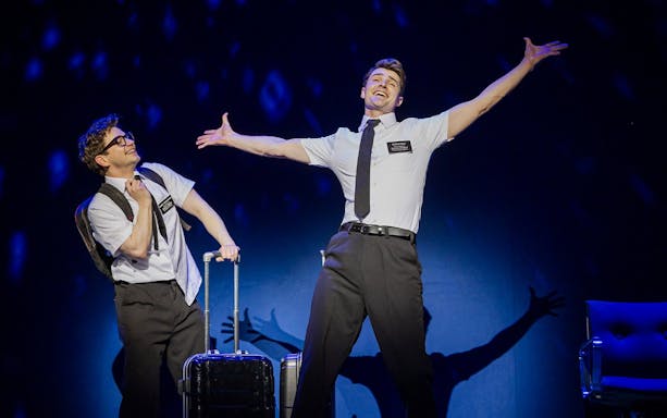 Stage performance of The Book of Mormon in Brisbane with two actors in character.