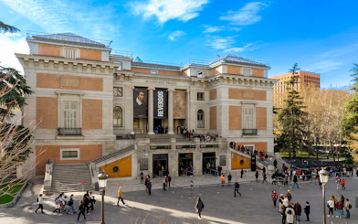 Prado Museum entrance with visitors in Madrid, Spain.