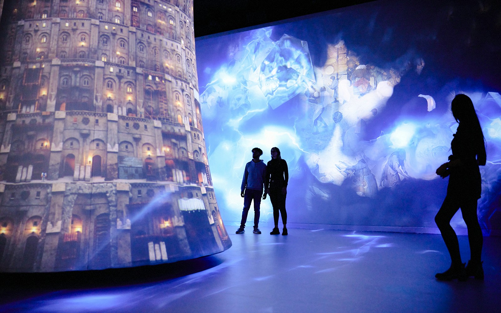 Guests exploring digital art projections at REMASTERED in Rotterdam.