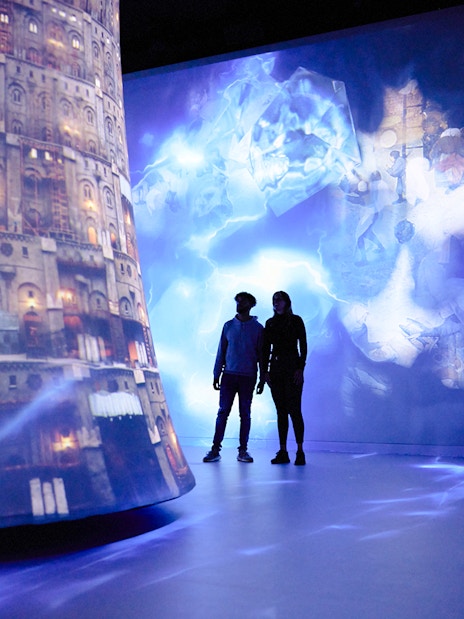 Guests exploring digital art projections at REMASTERED in Rotterdam.