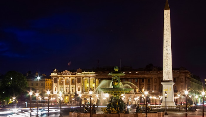 Place de la Concorde at night with Luxor Obelisk and fountain, Paris, France.