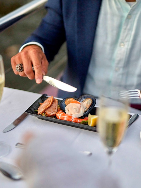 Dinner on Spirit of Melbourne Cruise with seafood platter and champagne on Yarra River.