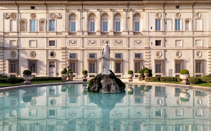 Borghese Gallery facade with fountain and statue in Rome, Italy.