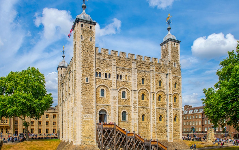 Tower of London exterior with visitors, part of early access guided tour.