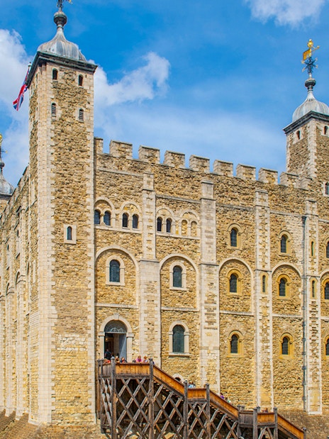 Tower of London exterior with visitors, part of early access guided tour.