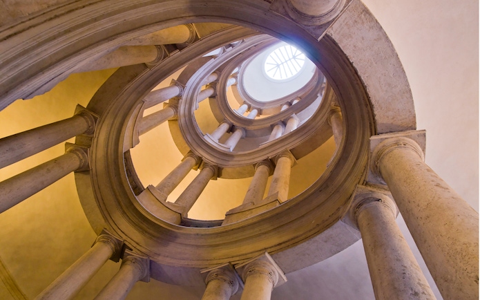 Barberini Palace spiral staircase in Rome, view from below, featured in skip-the-line tour tickets.