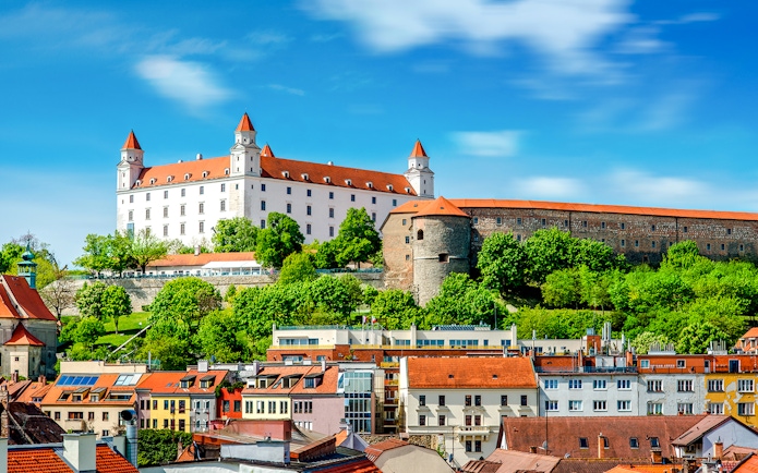 Bratislava Castle overlooking colorful rooftops in Bratislava, Slovakia.