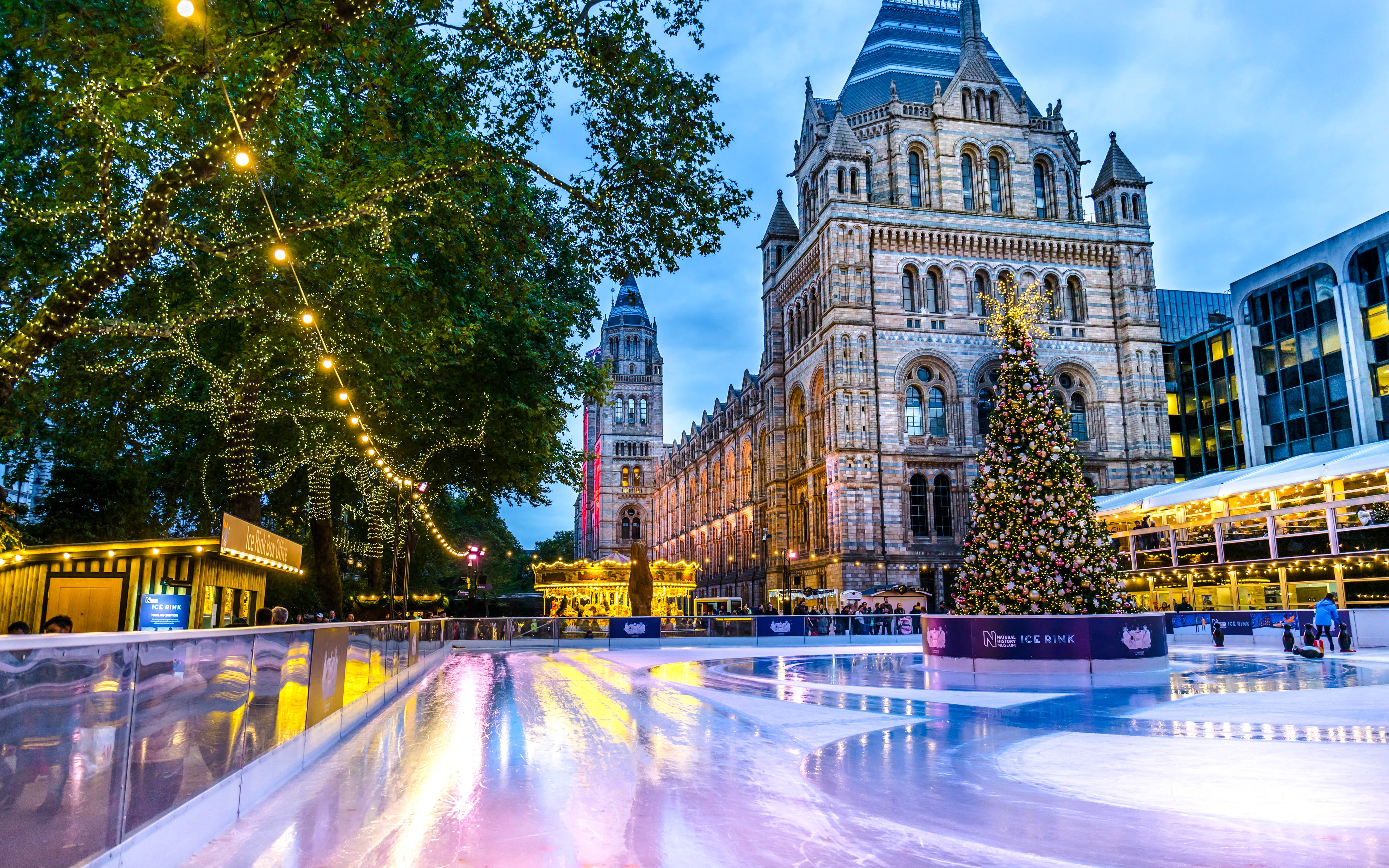 Ice rink and Christmas tree at Natural History Museum, London.
