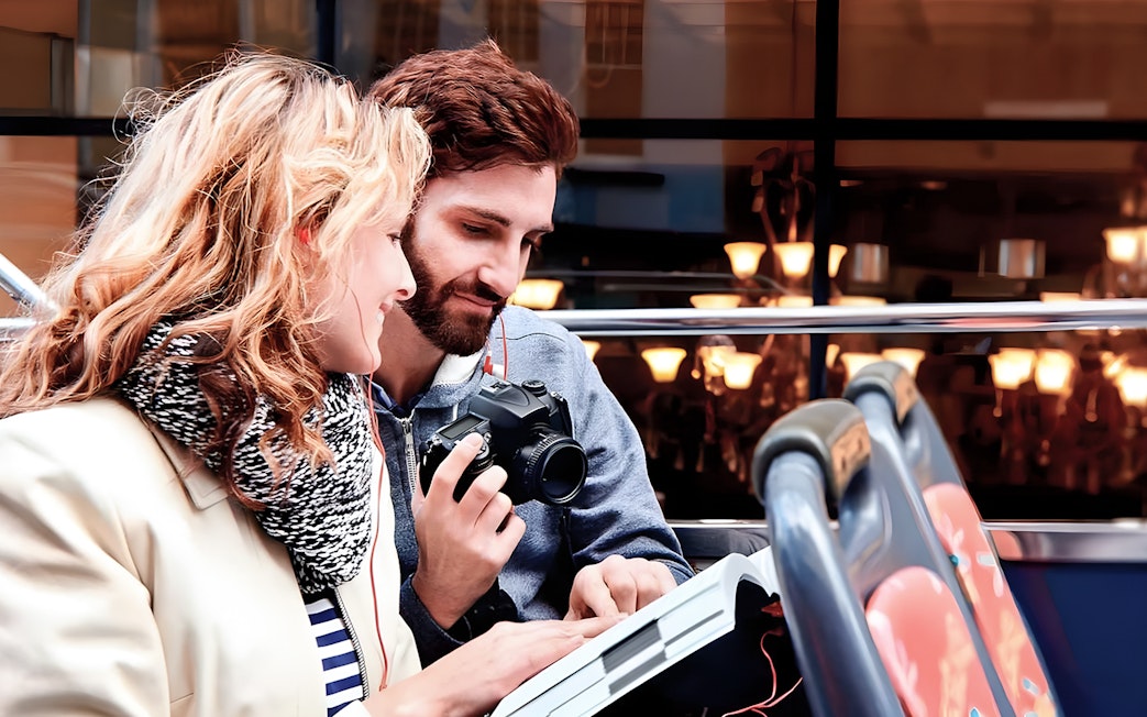 Couple enjoying view on Toronto Hop-On Hop-Off Bus upper deck.