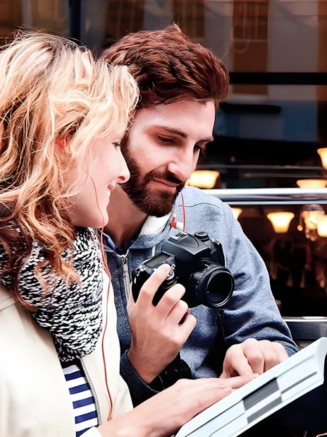Couple enjoying view on Toronto Hop-On Hop-Off Bus upper deck.