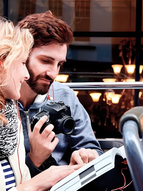 Couple enjoying view on Toronto Hop-On Hop-Off Bus upper deck.
