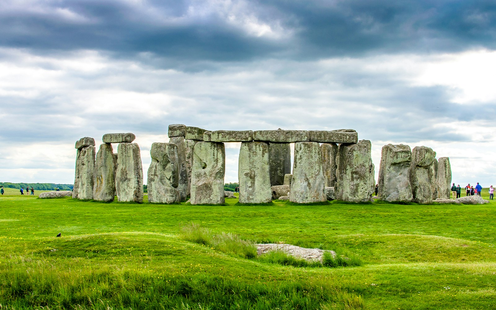 Stonehenge with Slaughter Stone in foreground, Wiltshire, England.