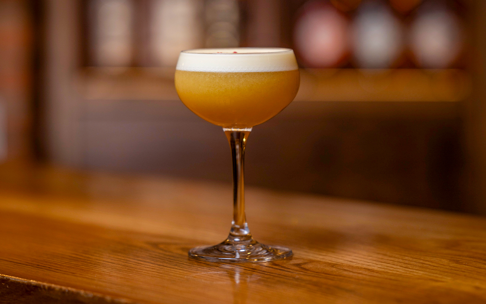 Jameson Distillery cocktail-making class with whiskey bottles and mixing tools in Dublin, Ireland.