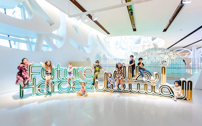 Children playing at the Future Heroes exhibit in the Museum of The Future, Dubai.