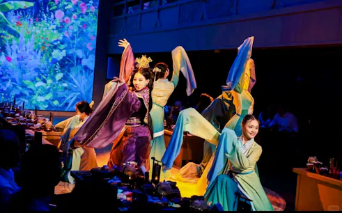 Performers in traditional costumes during a live show on the Pearl River Night Cruise, Guangzhou.