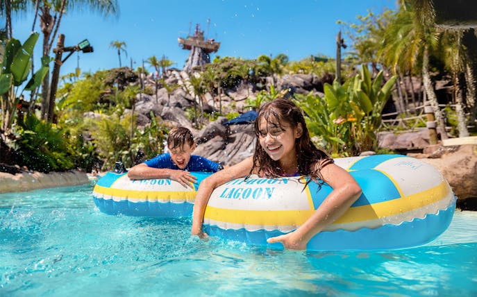 Kids enjoying pool with tubes at Typhoon Lagoon, Walt Disney World Resort, Orlando.