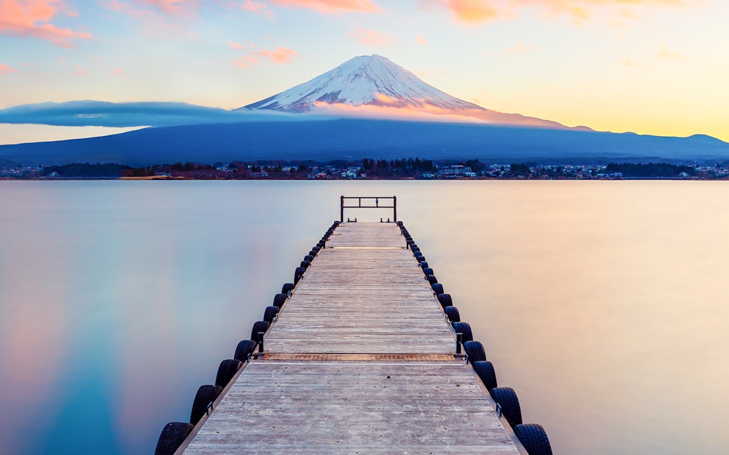 Dock leading to Lake Kawaguchi with Mt. Fuji in the background, Japan.