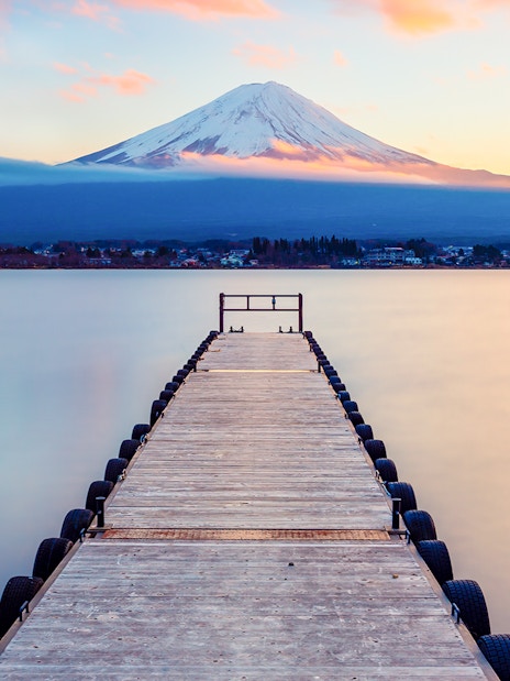 Dock leading to Lake Kawaguchi with Mt. Fuji in the background, Japan.