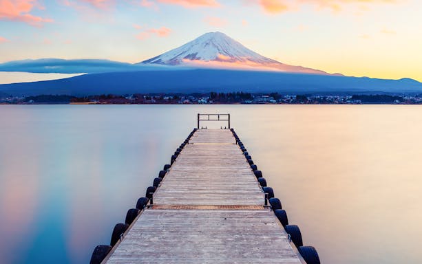 Dock leading to Lake Kawaguchi with Mt. Fuji in the background, Japan.