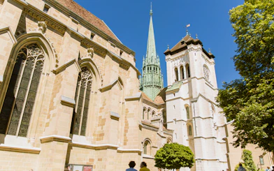St. Pierre Cathedral in Geneva with its iconic spire on a sunny day.
