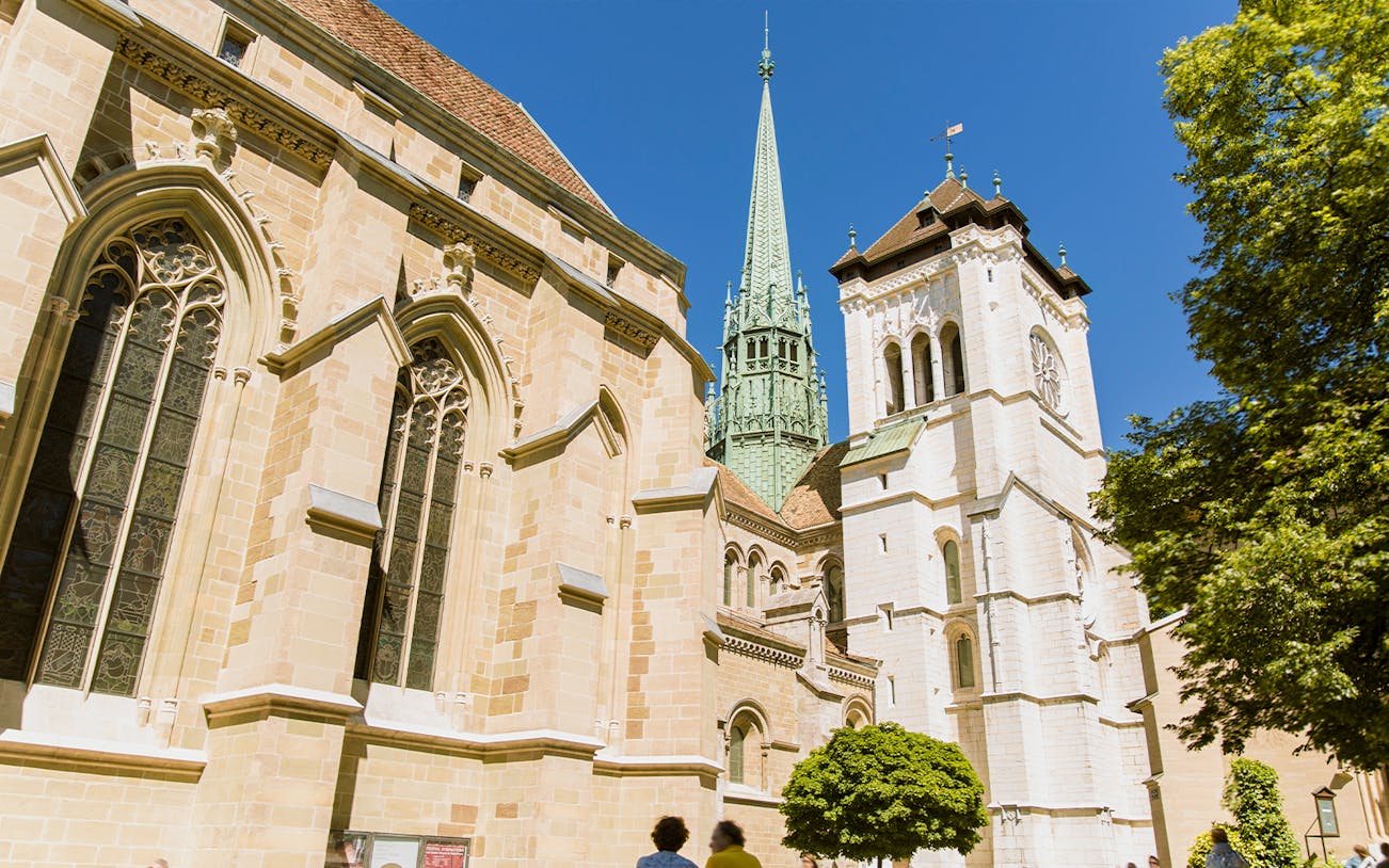 St. Pierre Cathedral in Geneva with its iconic spire on a sunny day.
