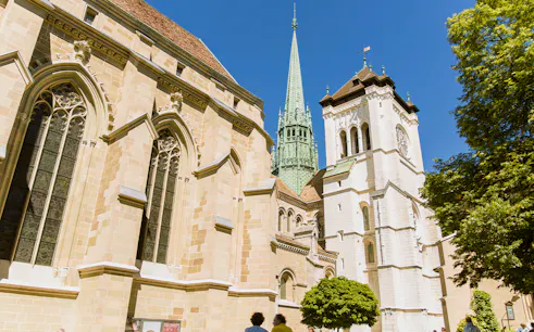 St. Pierre Cathedral in Geneva with its iconic spire on a sunny day.