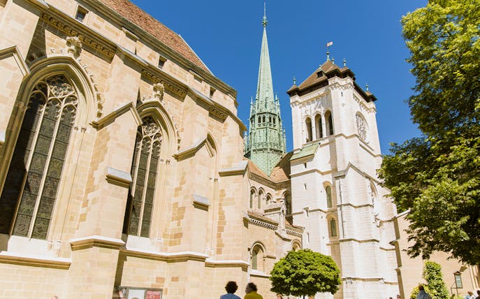 St. Pierre Cathedral in Geneva with its iconic spire on a sunny day.