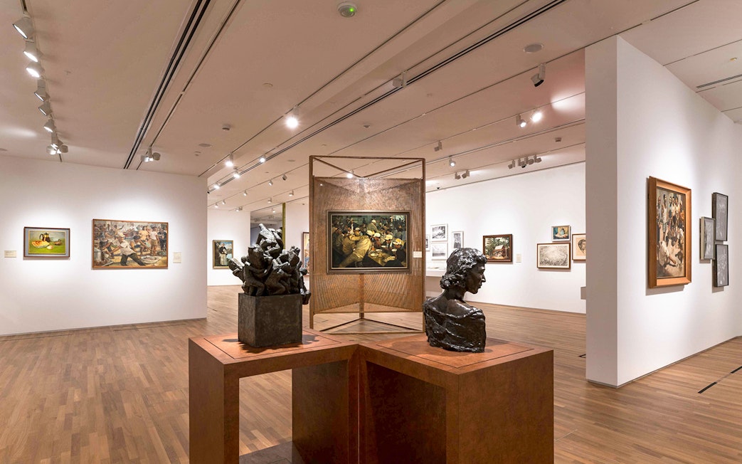 Art sculptures and paintings inside National Gallery Singapore exhibit.